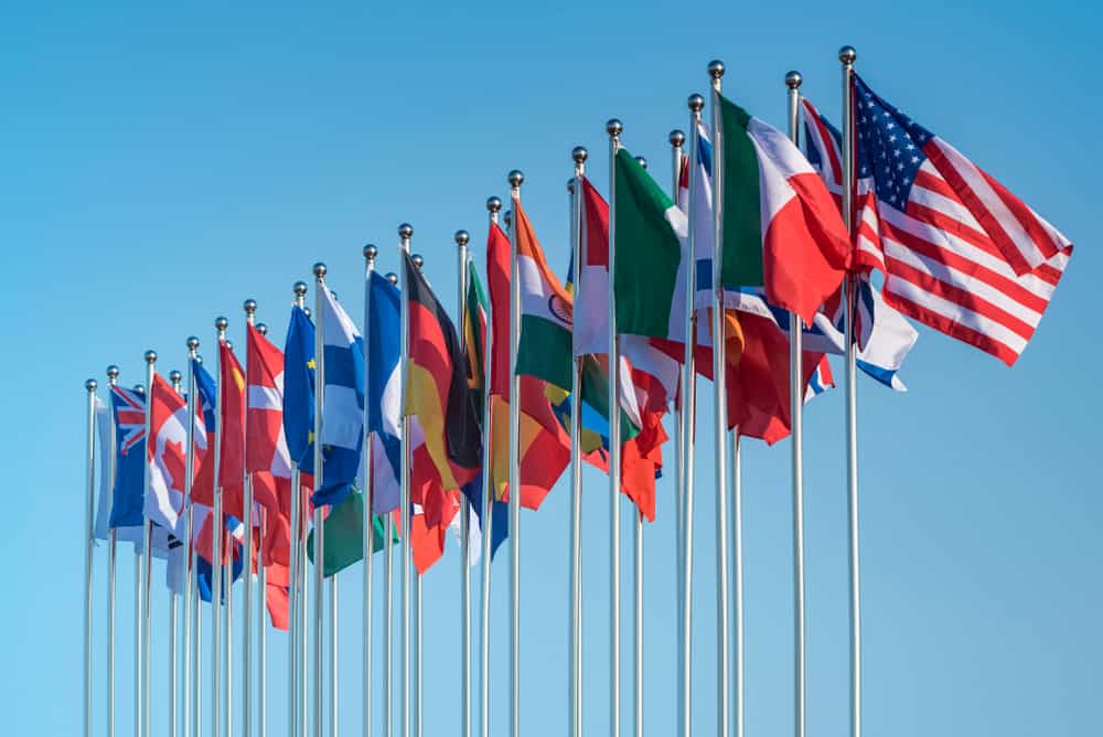 Various country flags flying together