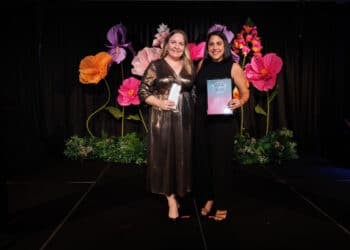 Brooke Adamson (left) receiving the Excellence in Mining Award from the Australian Flexible Pavement Association's executive director of technology, Melissa Lyons. Image: Prime Creative Media