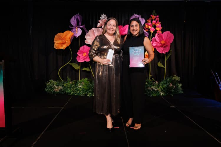 Brooke Adamson (left) receiving the Excellence in Mining Award from the Australian Flexible Pavement Association's executive director of technology, Melissa Lyons. Image: Prime Creative Media